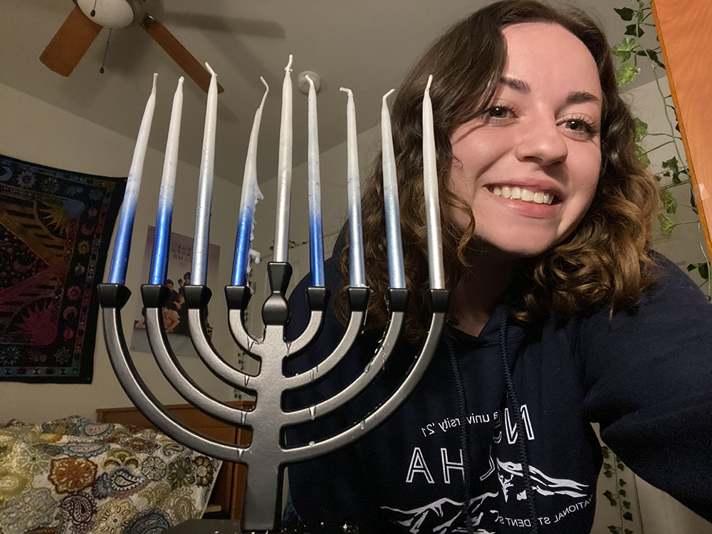 Kylee Kelley with a menorah