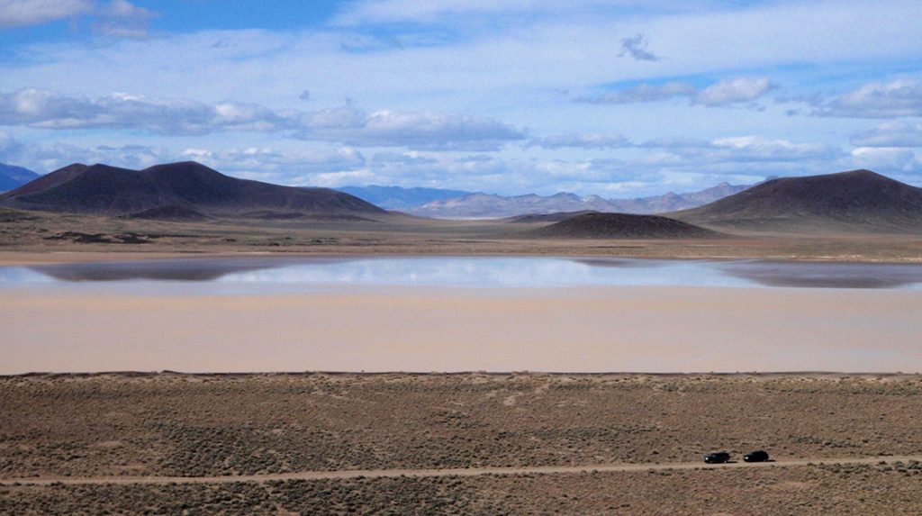 The peaks of monogenetic volcanoes, viewed across Lunar Lake in Nevada.
