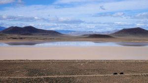 The peaks of monogenetic volcanoes, viewed across Lunar Lake in Nevada.