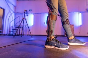 Child walks with exoskeleton on legs