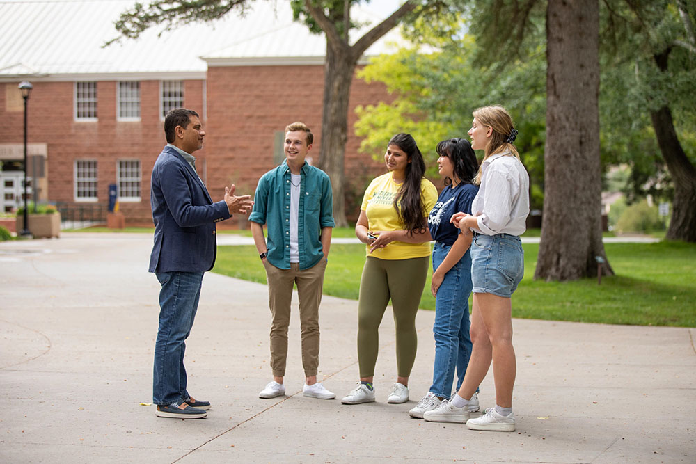 President Cruz Rivera talking to students outside