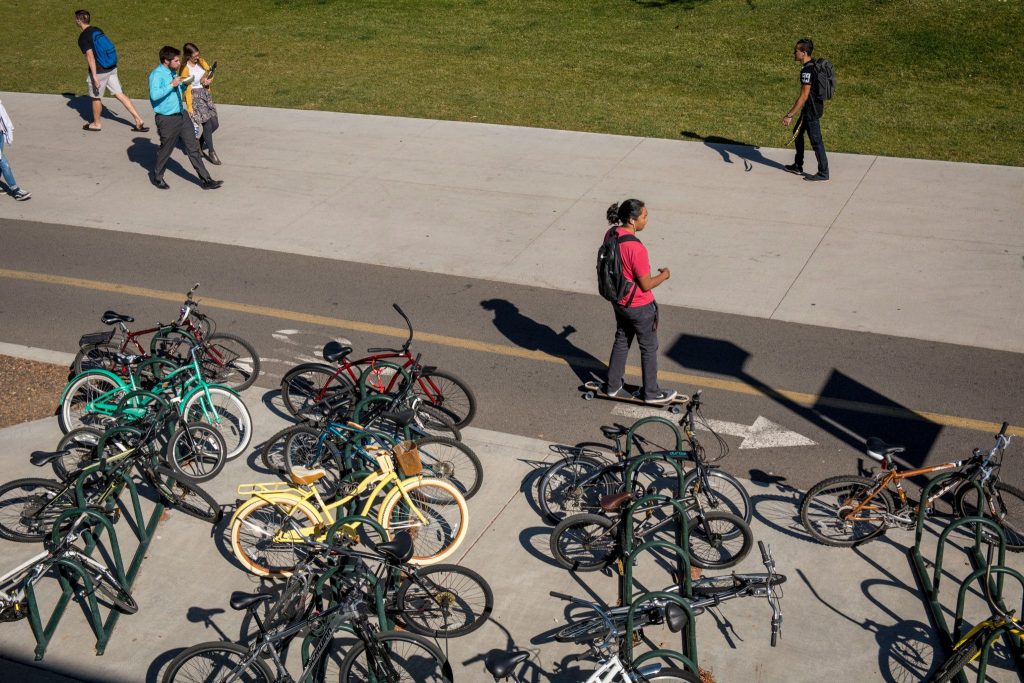 Picture of NAU Pedway with a student in the bike lane.