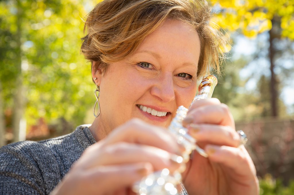 Andrea Graves holding a flute