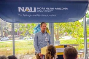 Jason Ladner speaking at an event with PMI
