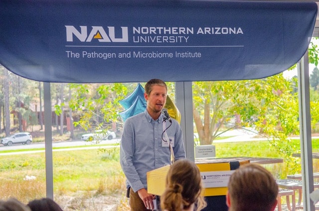 Jason Ladner speaking at an event with PMI