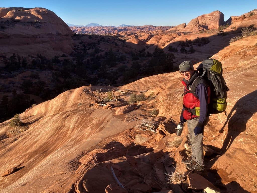 Peter Friederici backacking through a canyon