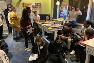 7-KATE-CARROLL-MENTORING a room full of students-LATE into evening