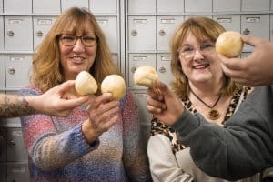 Postal workers hold up buns