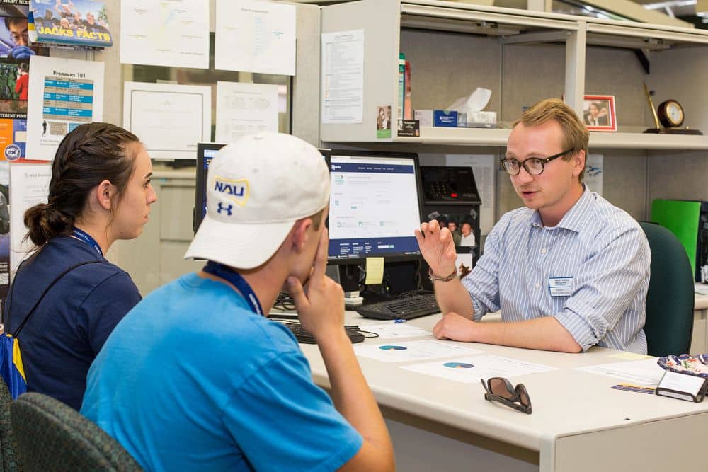 NAU advisor talks with students
