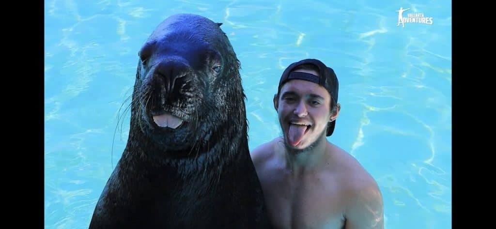 Greyson Sterba with a sea lion