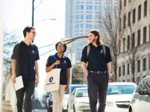 Americorps volunteers walking down the street