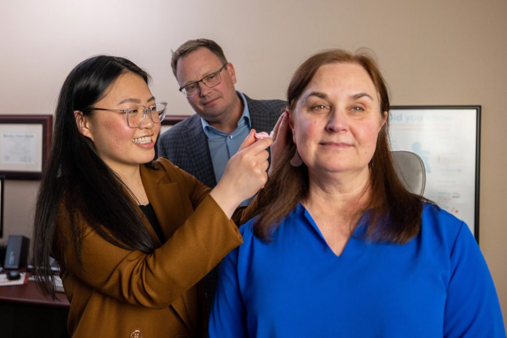 A woman has her ear examined in NAU's Speech-Language-Hearing Clinic.