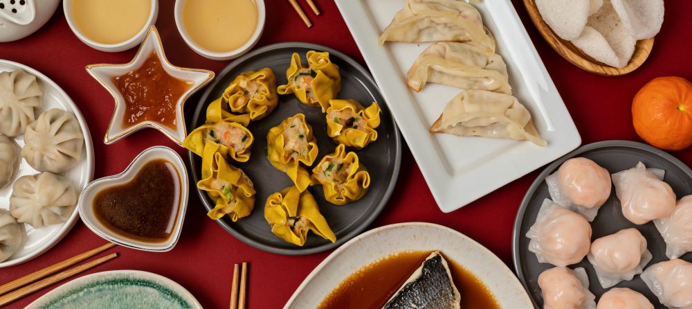 Lunar New Year festival table over red background. Traditional lunar new year food.