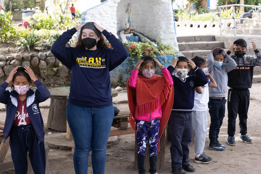 A student in the 2022 GCPS cohort plays with students in Quito, Ecuador.