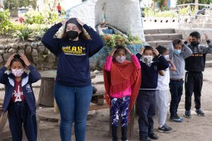 A student in the 2022 GCPS cohort plays with students in Quito, Ecuador.