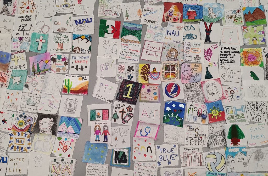 squares of 2 by 2 inch fabric with colorful drawings and writing