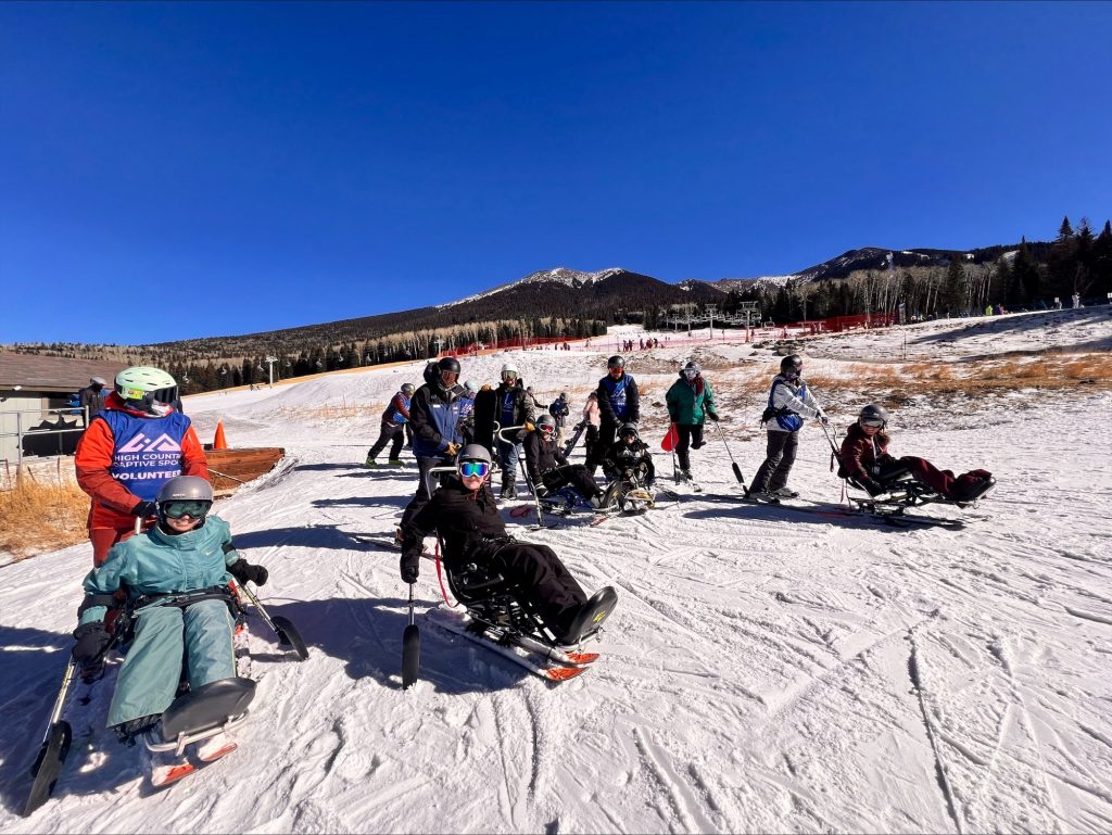 People with disabilities do adaptive skiing