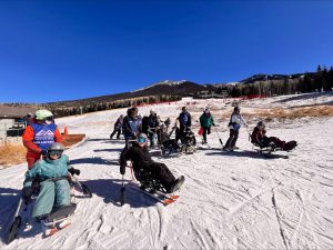 People with disabilities do adaptive skiing