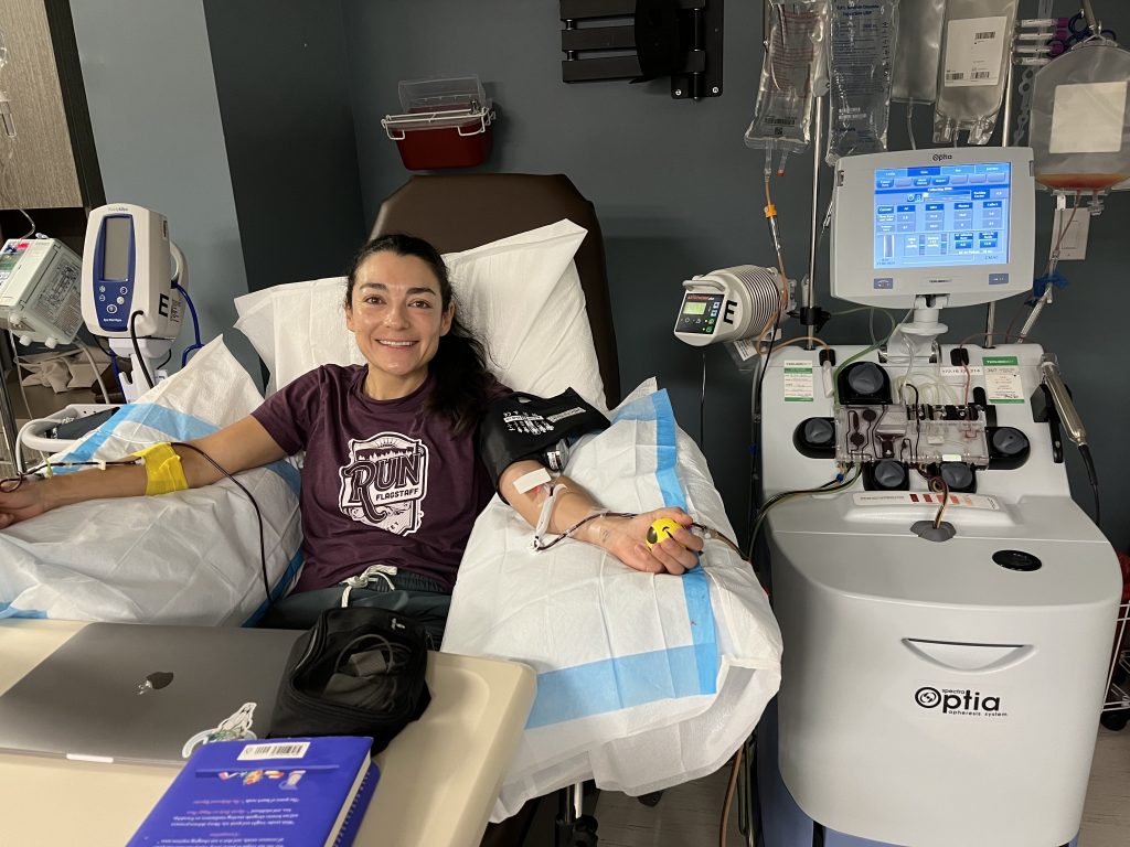Andrea Trujillo Lerner hooked up to an apheresis machine to donate stem cells.