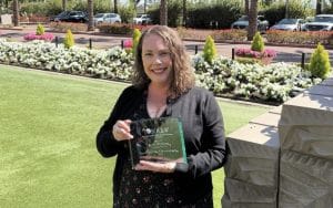 Katy Montoya holding an award