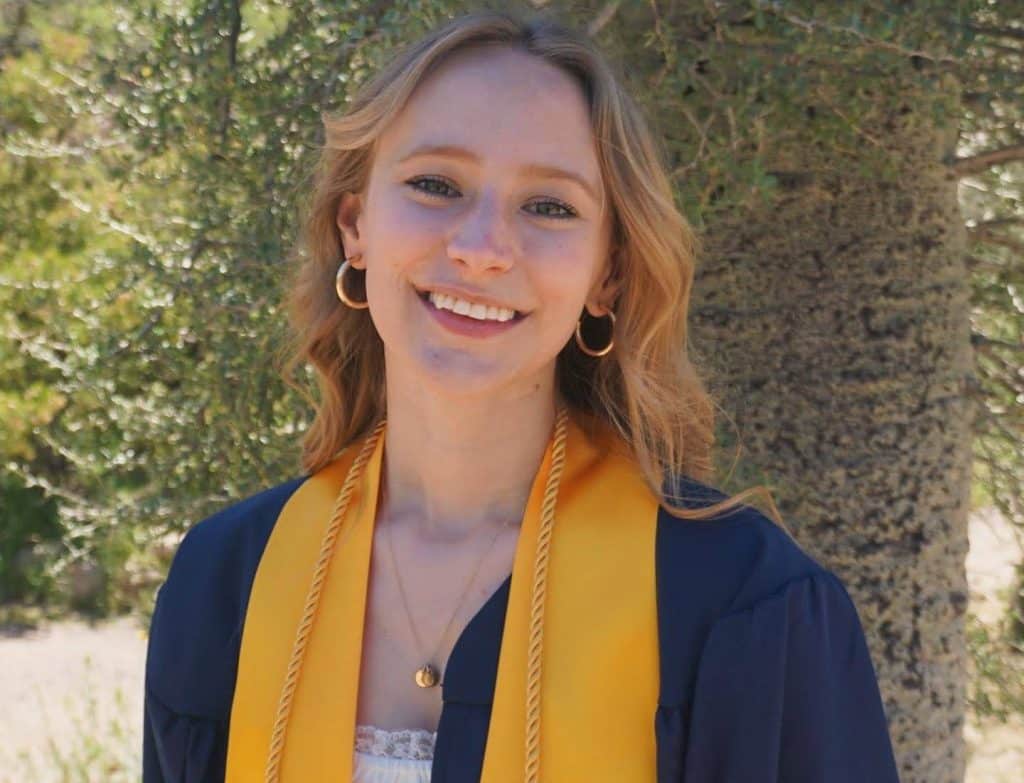 Nicole Sylvester in NAU graduation regalia