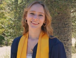 Nicole Sylvester in NAU graduation regalia