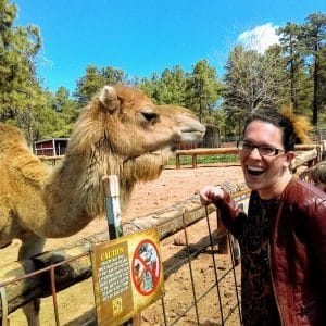 River Olsen next to a camel