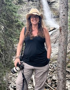 Beth Staub holding a camera