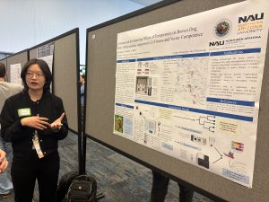 Anna Kang pressenting a poster at a conference