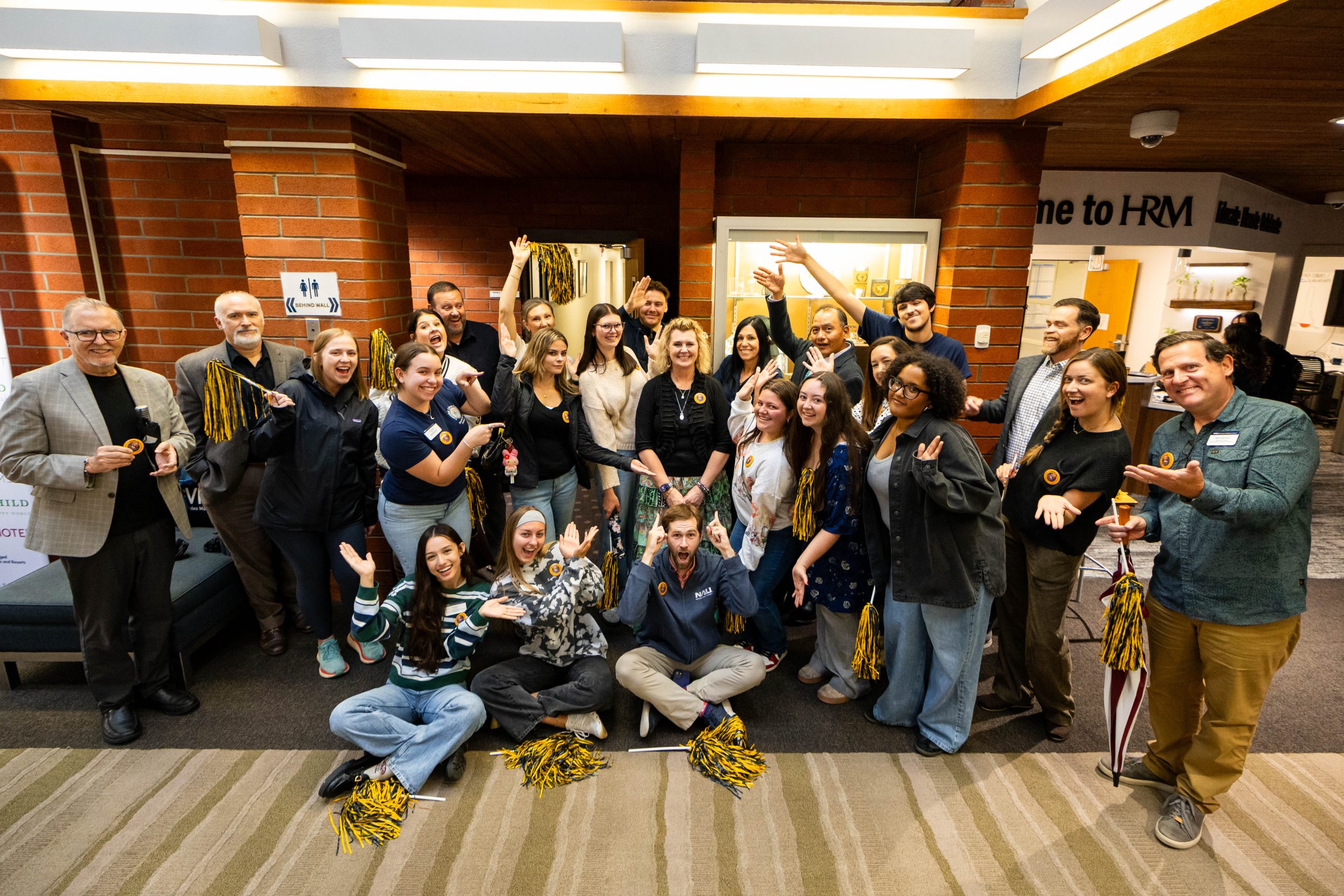 Group of faculty, staff and students pose with Kathleen King