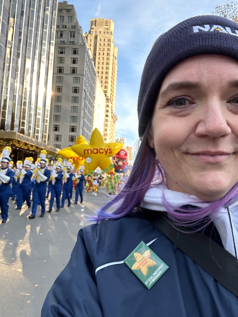 Stephanne taking a selfie in New York City at the Macy's Thanksgiving Day Parade.