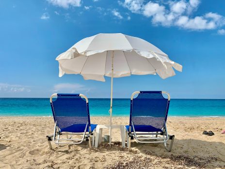 Image of 2 beach chairs facing the ocean