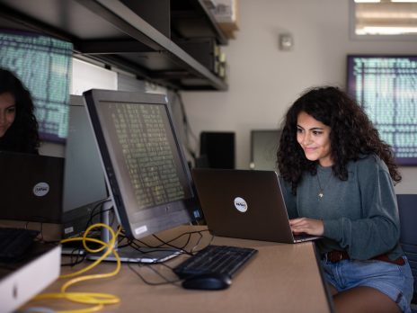 Student working on laptop computer.