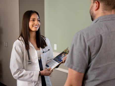 NAU health student talking to a patient